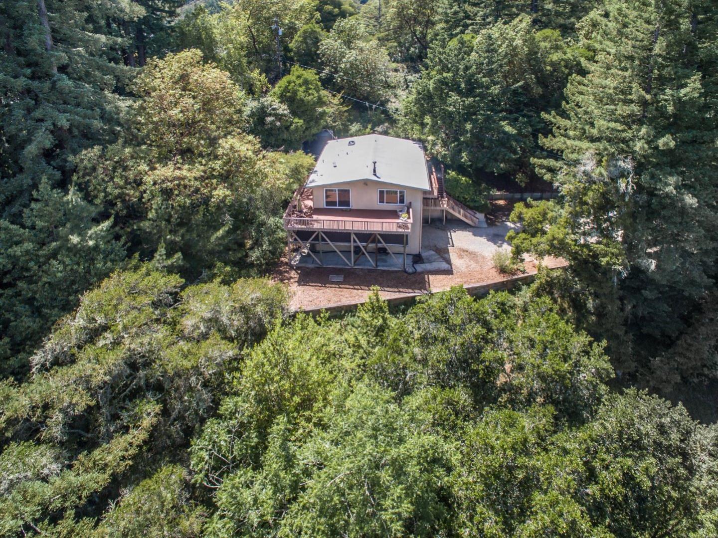 655 Aurora Road Soquel, CA 95073 - Photo 19 of 22 a view of a house with a yard and large trees