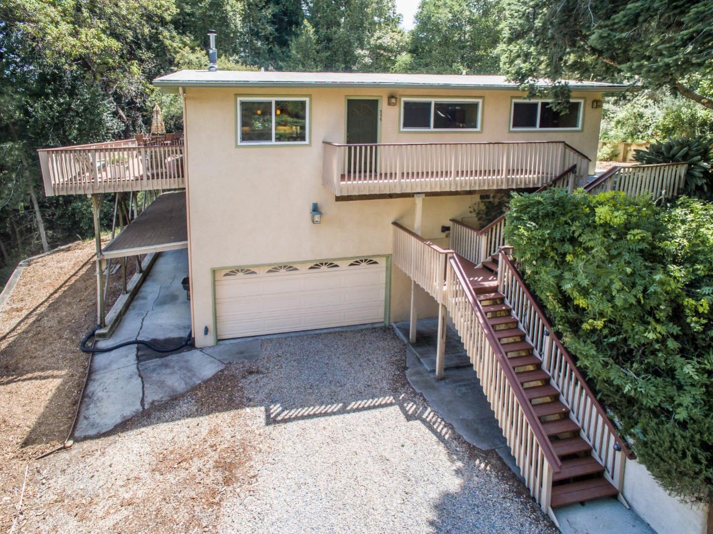 655 Aurora Road Soquel, CA 95073 - Photo 2 of 22 a view of a house with a backyard