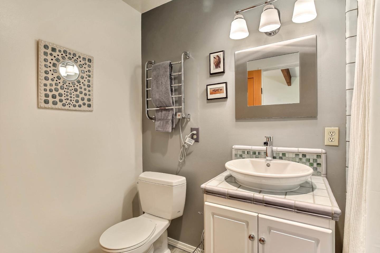 655 Aurora Road Soquel, CA 95073 - Photo 10 of 22 a bathroom with a toilet sink and mirror