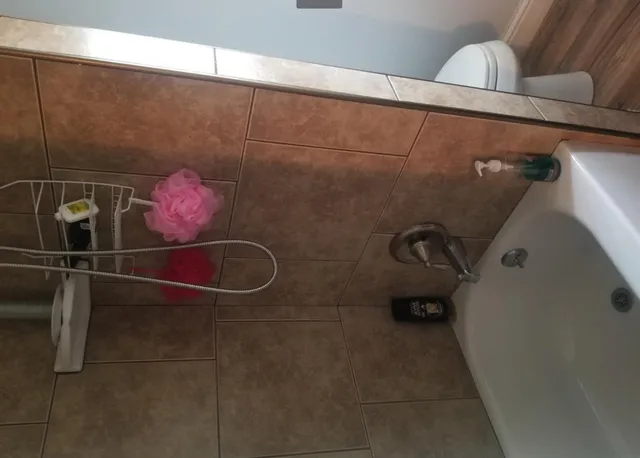 a bathroom with a sink and mirror