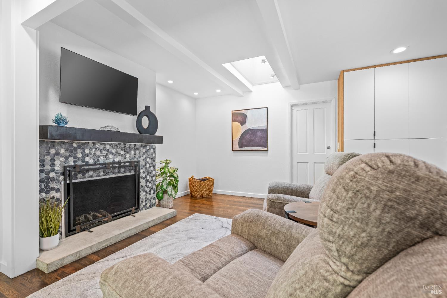 71 Convent Court San Rafael, CA 94901 - Photo 13 of 37 a living room with furniture a fireplace and a flat screen tv