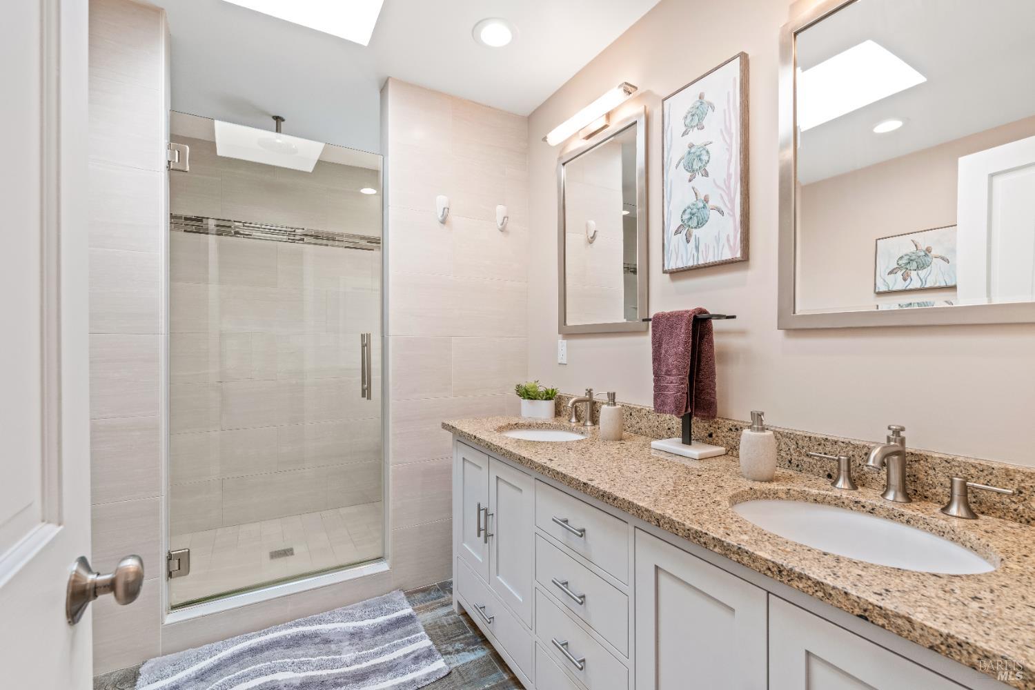 71 Convent Court San Rafael, CA 94901 - Photo 19 of 37 a bathroom with a granite countertop double vanity sink mirror and shower