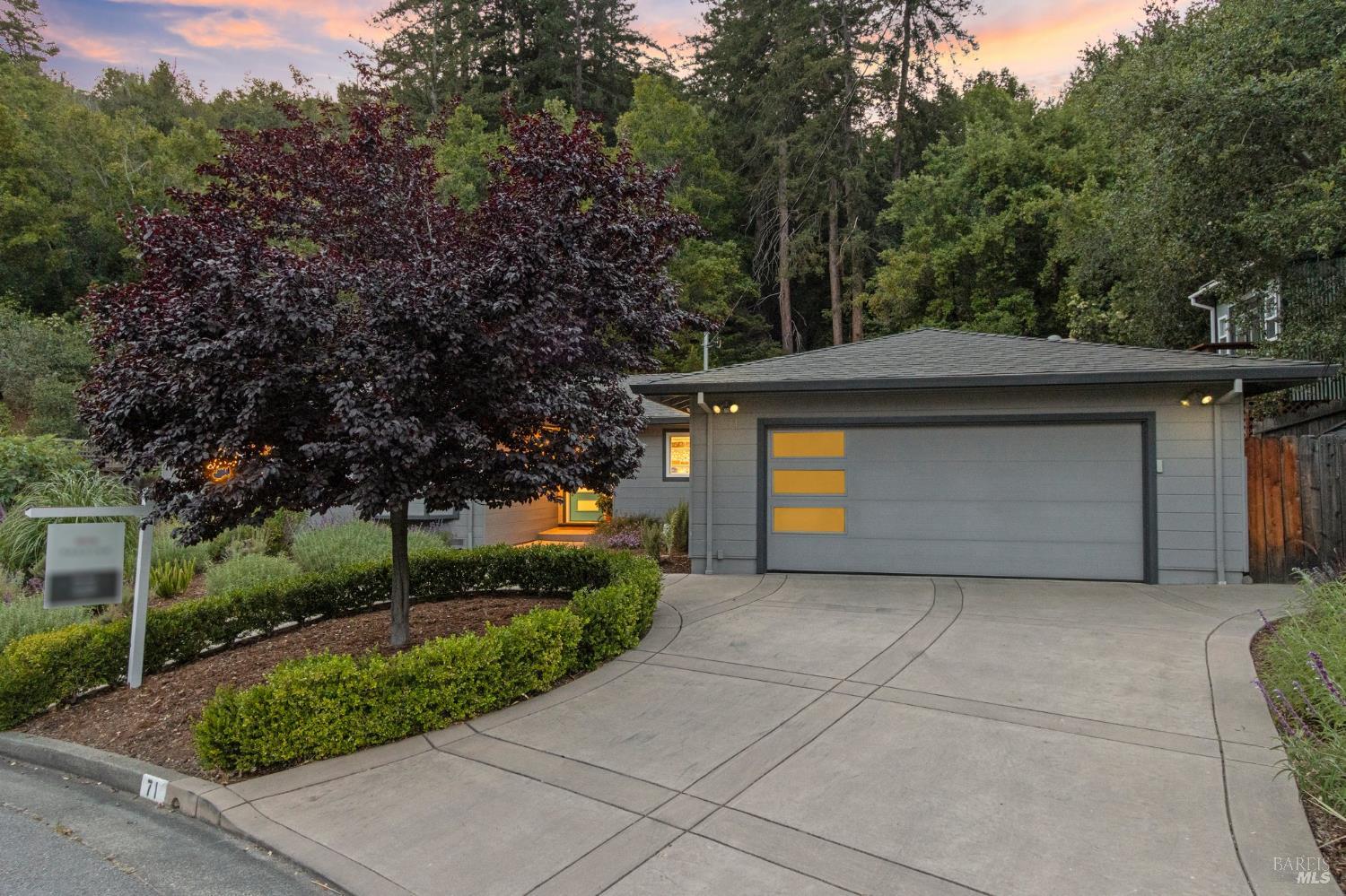 71 Convent Court San Rafael, CA 94901 - Photo 2 of 37 a front view of a house with a yard and garage
