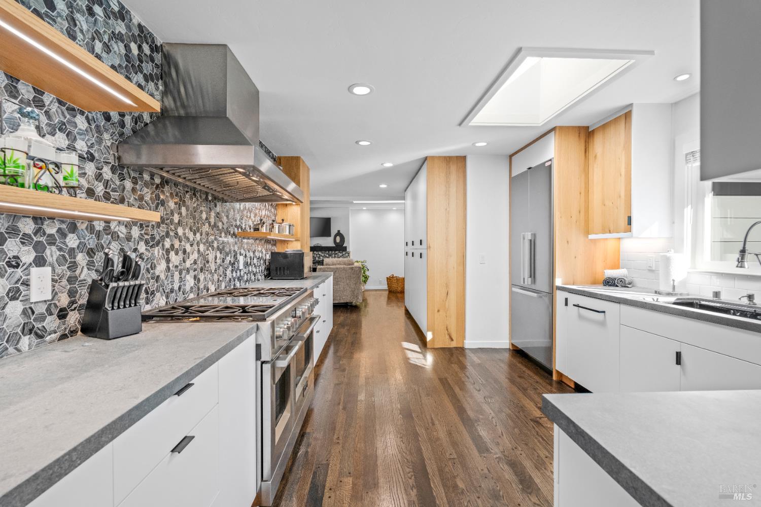 71 Convent Court San Rafael, CA 94901 - Photo 5 of 37 a kitchen with stainless steel appliances granite countertop a lot of counter space and wooden floors