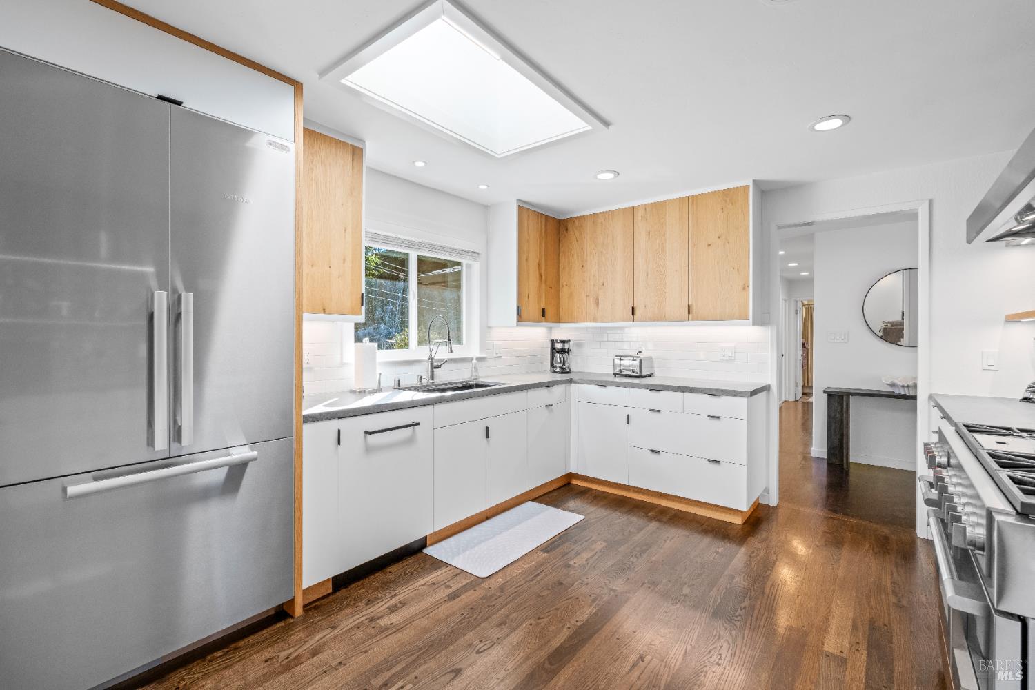 71 Convent Court San Rafael, CA 94901 - Photo 7 of 37 a kitchen with a refrigerator a sink and wooden floor