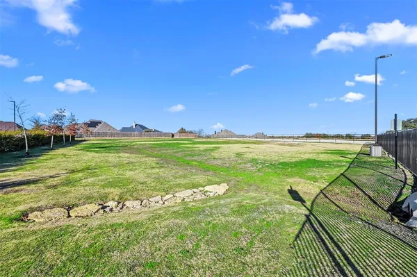 a view of an ocean and a yard