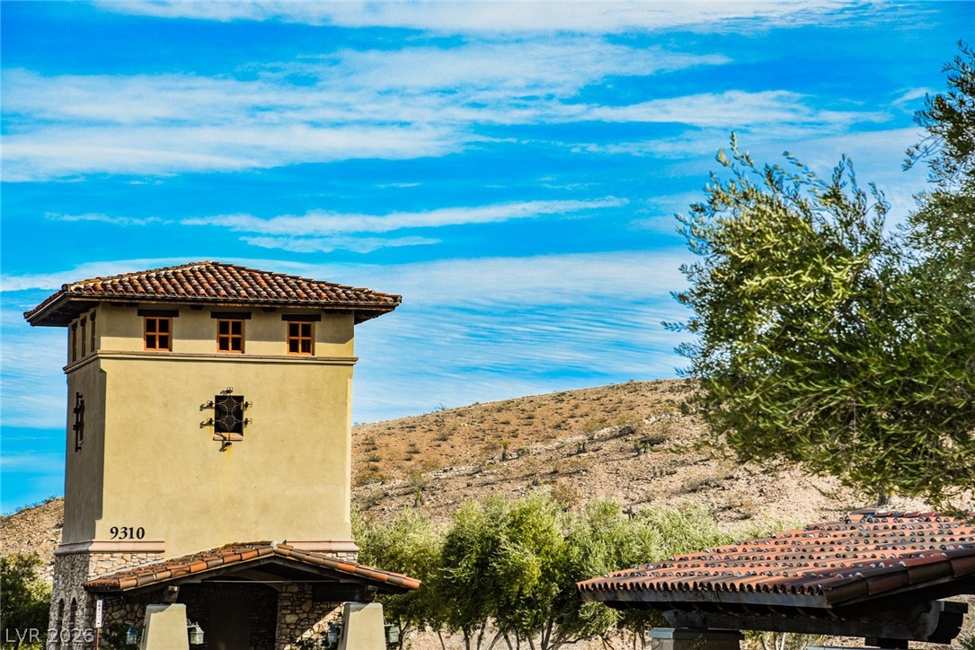 9916 Sable Point Street Las Vegas, NV 89178 - Photo 69 of 73 A striking desert abode with a terracotta tile roof and stone accents.