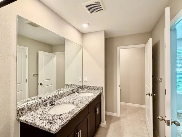 a white toilet sitting next to a bath tub