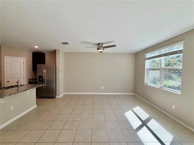 a kitchen with stainless steel appliances granite countertop a sink stove and microwave