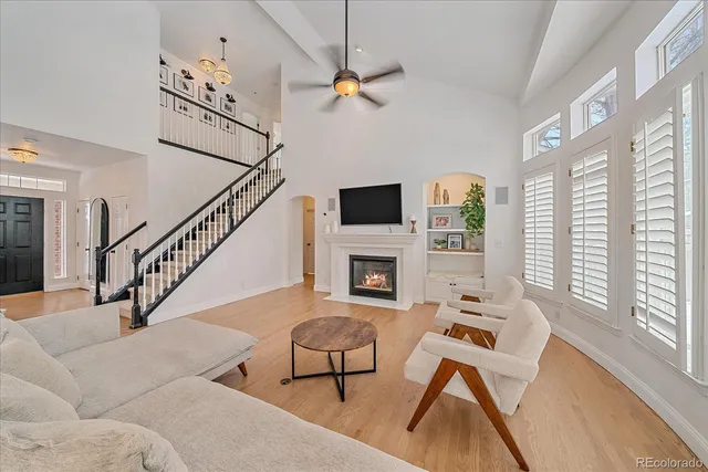 a living room with furniture fireplace and flat screen tv