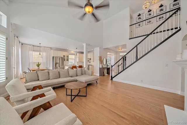 a living room with furniture and wooden floor
