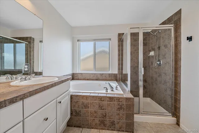 a bathroom with a bathtub and a sink