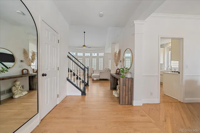 a view of entryway and hall with wooden floor