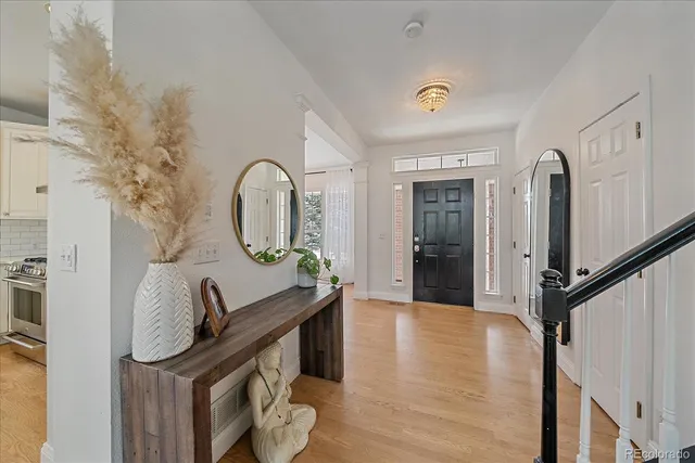 a view of a hardwood floor and staircase
