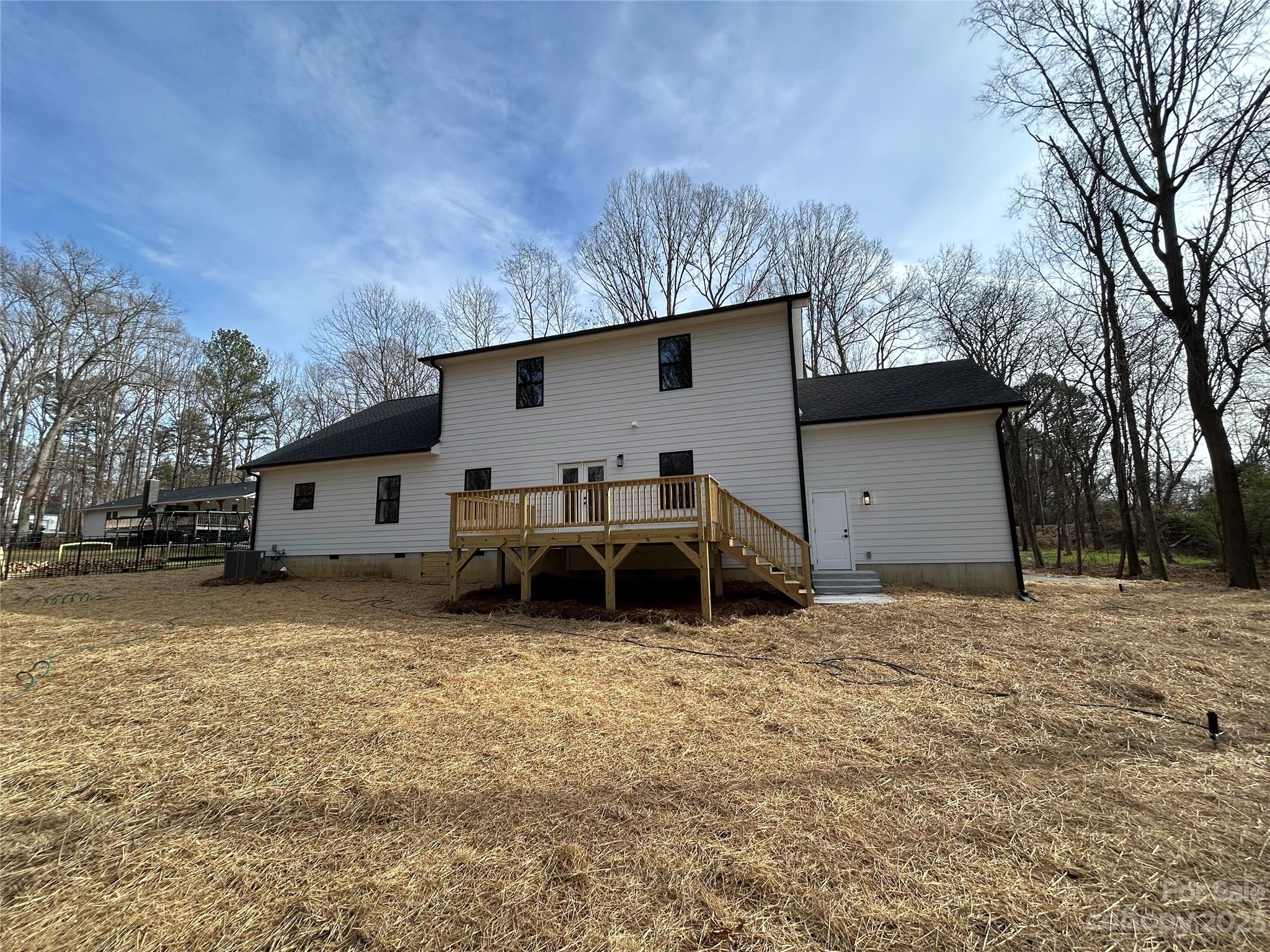 302 Lester Davis Road Waxhaw, NC 28173 - Photo 11 of 43 a view of a house with a back yard