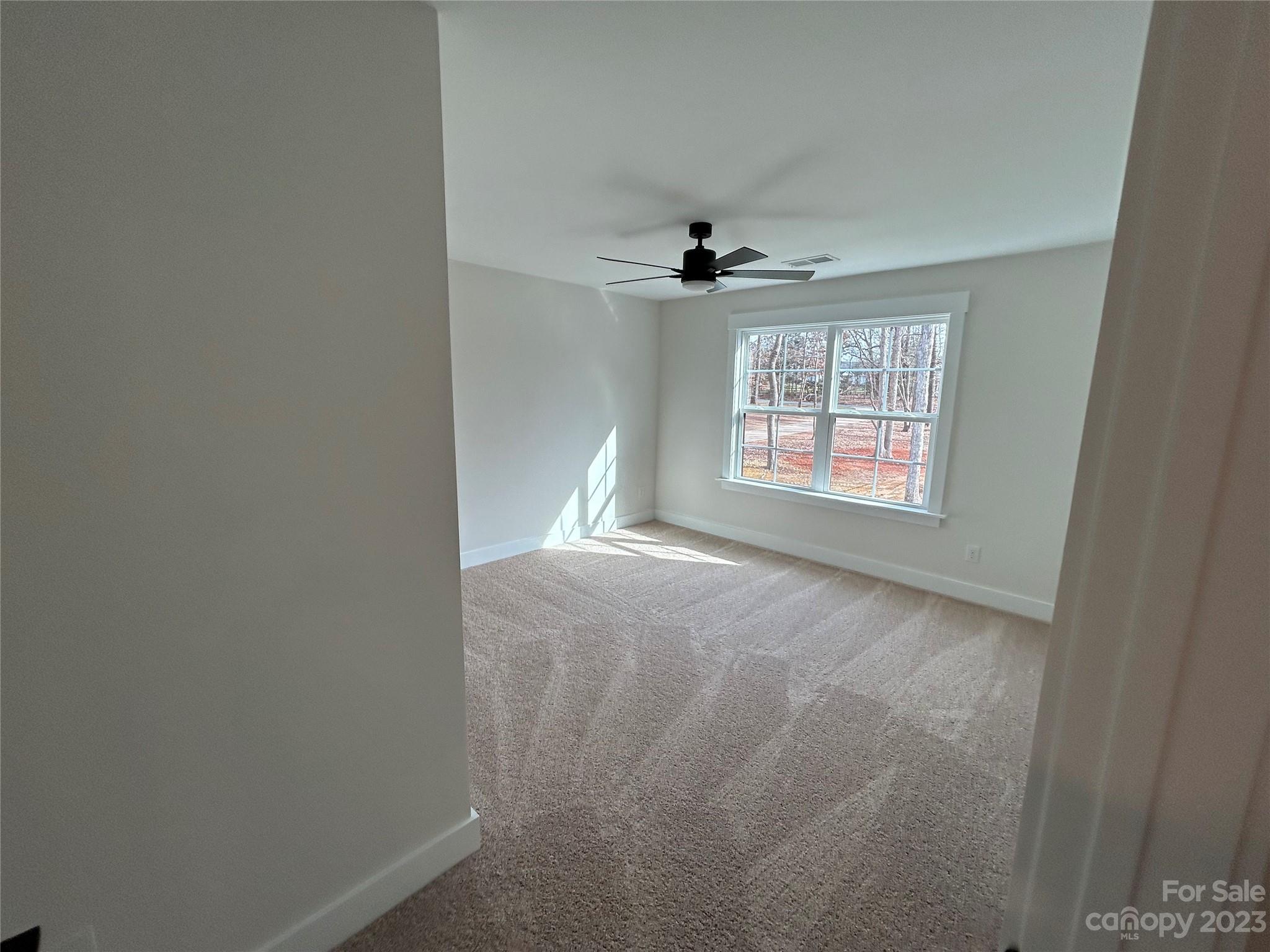 302 Lester Davis Road Waxhaw, NC 28173 - Photo 23 of 43 a view of an empty room with a window