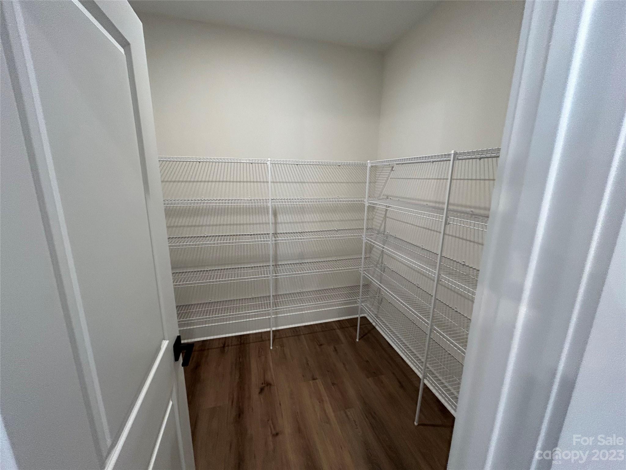 302 Lester Davis Road Waxhaw, NC 28173 - Photo 33 of 43 a view of walk in closet with wooden floor