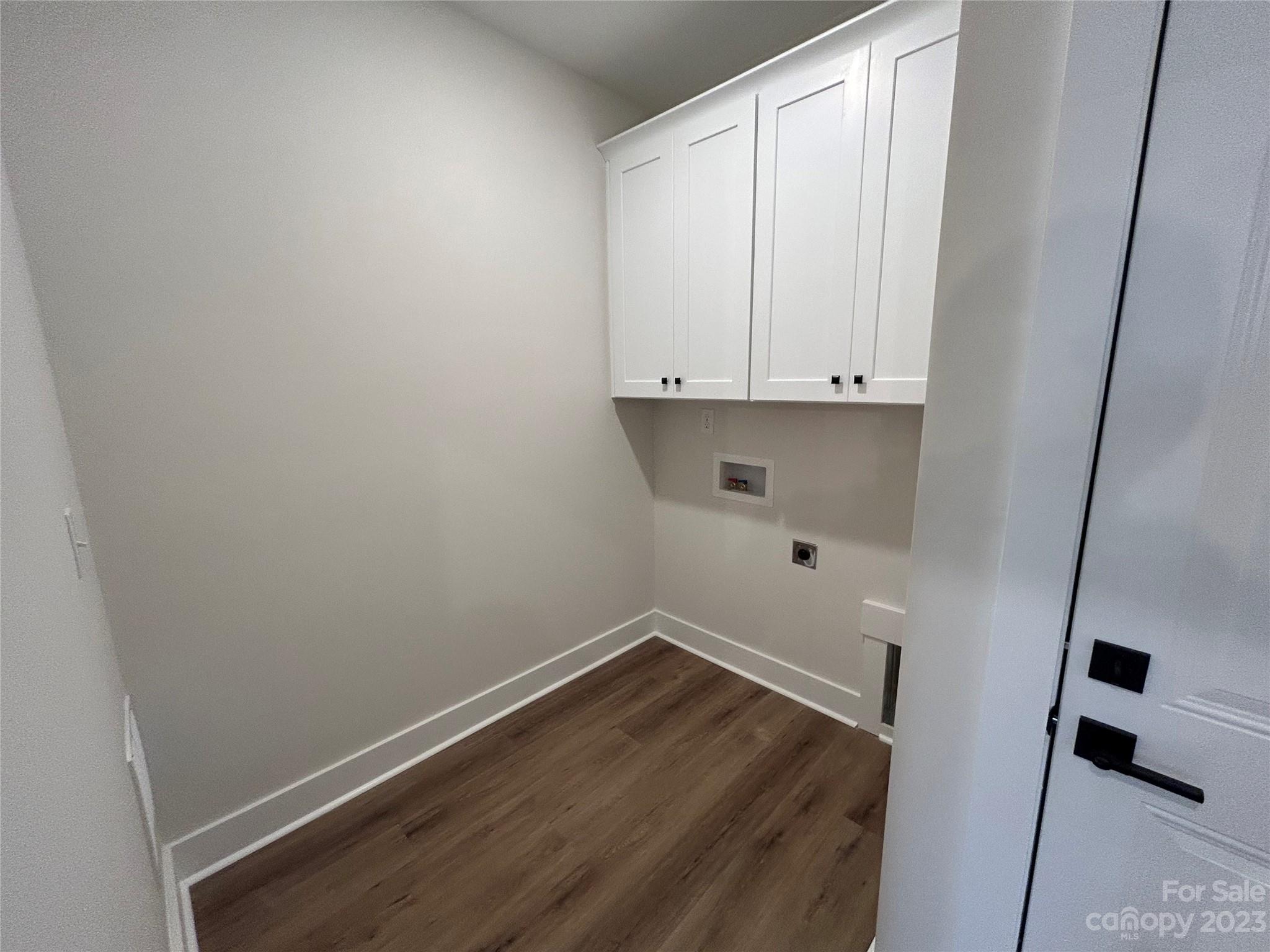 302 Lester Davis Road Waxhaw, NC 28173 - Photo 34 of 43 a view of storage and utility room with wooden floor