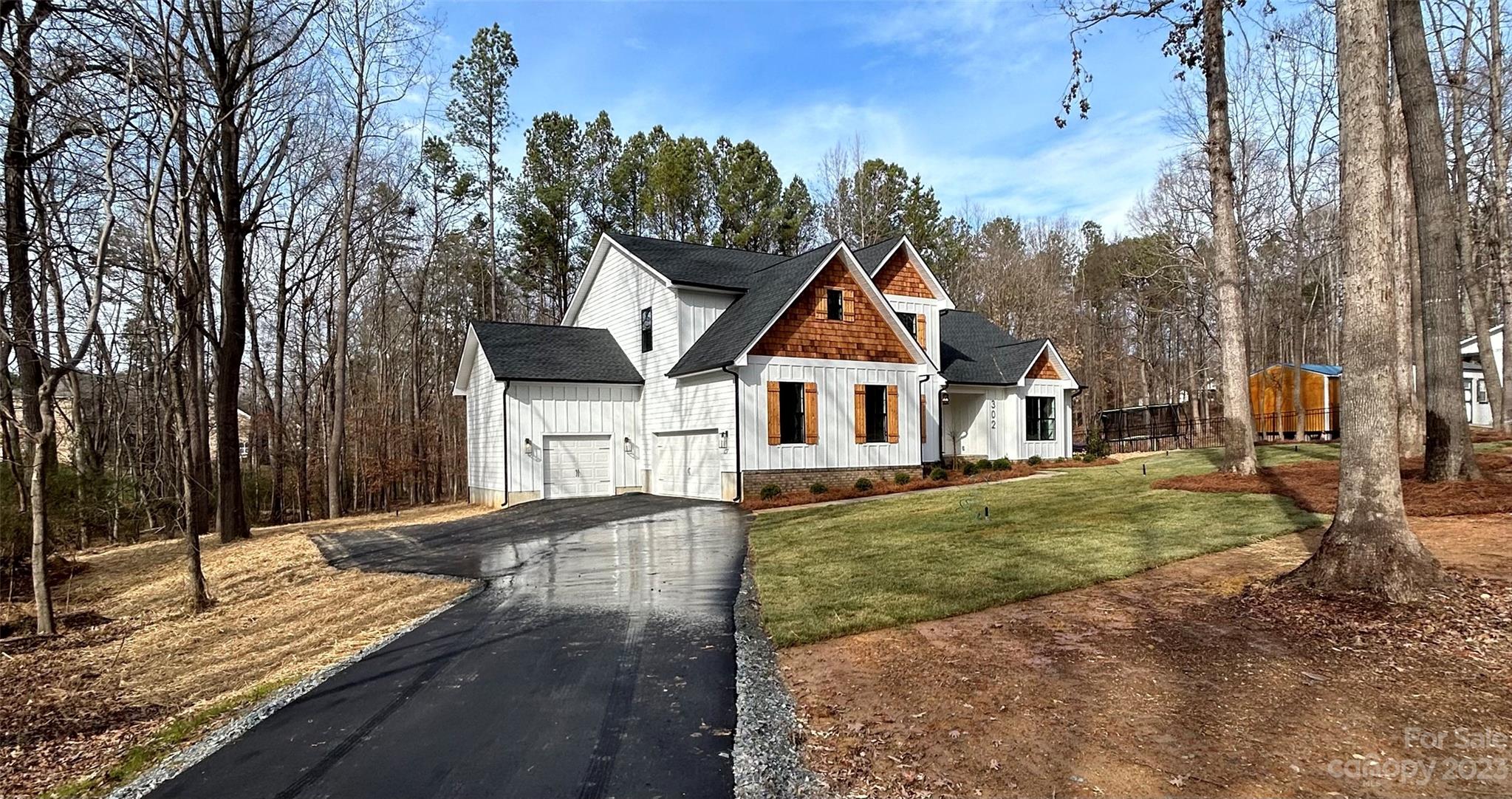 302 Lester Davis Road Waxhaw, NC 28173 - Photo 7 of 43 a view of a white house with a yard