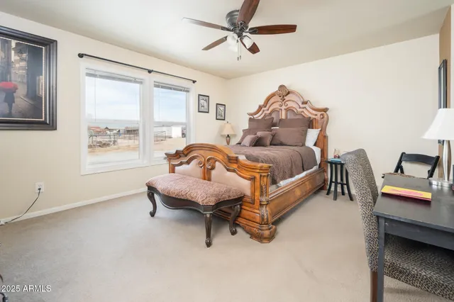 a en suite bathroom with a granite countertop sink and a mirror