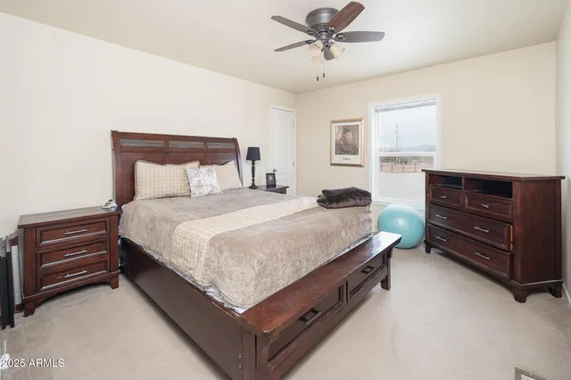 a bathroom with a granite countertop shower and a sink