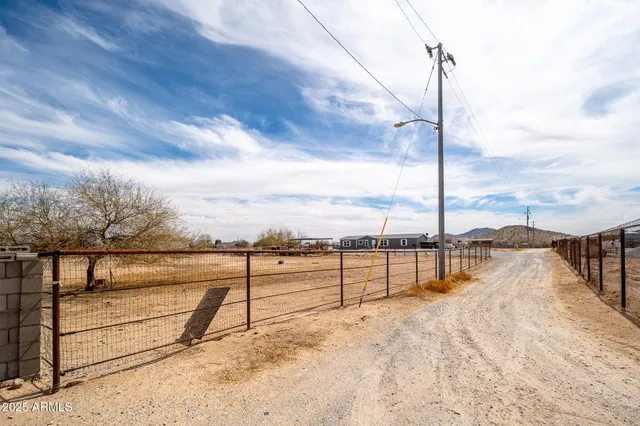 a view of a lake with houses in the back