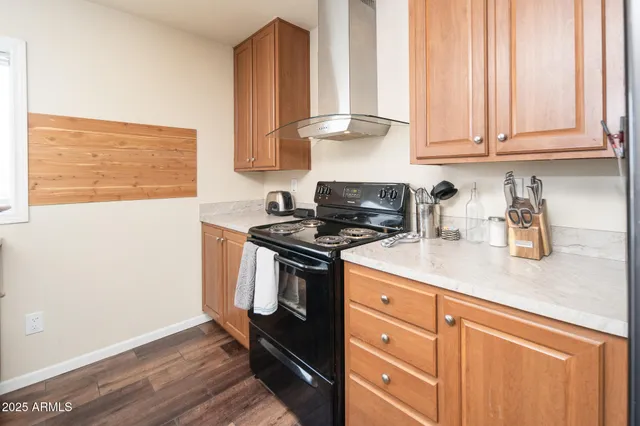 a living room with dining room and kitchen view