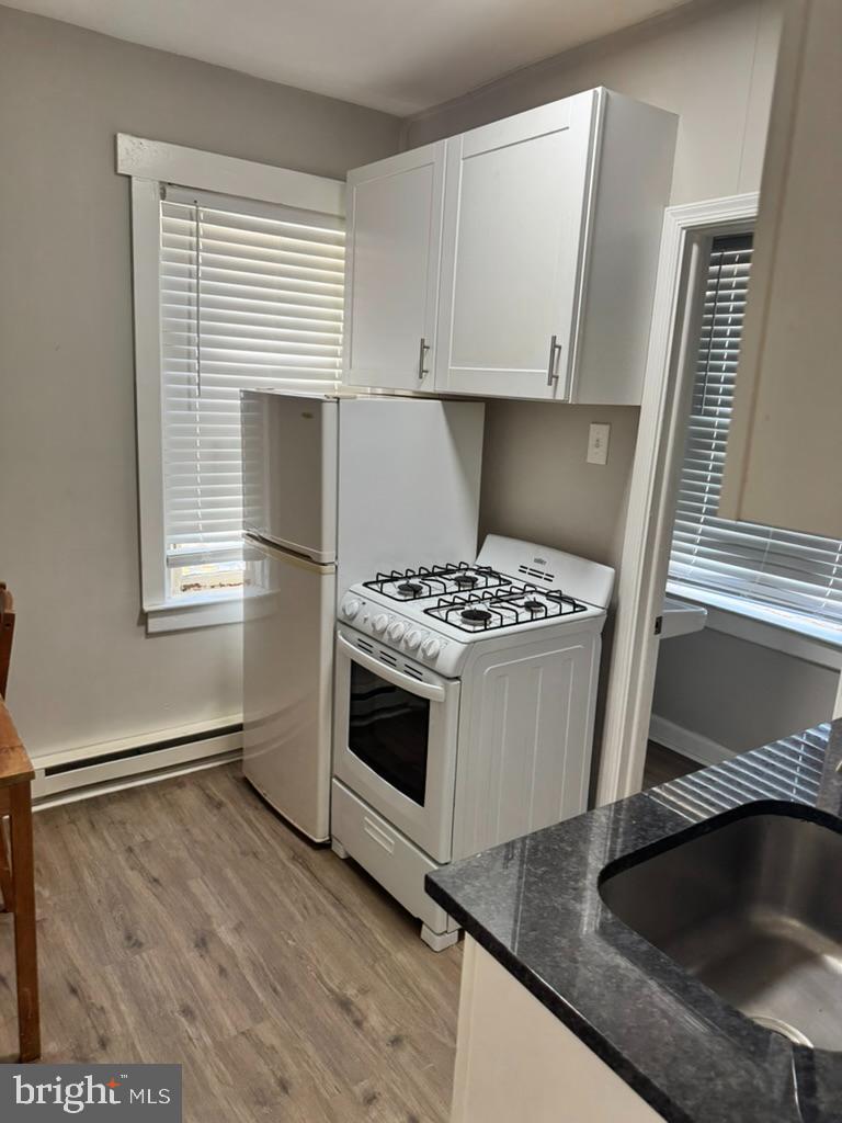 202-206 South Main Street Hatfield, PA 19440 - Photo 2 of 8 a kitchen that has a sink and a stove