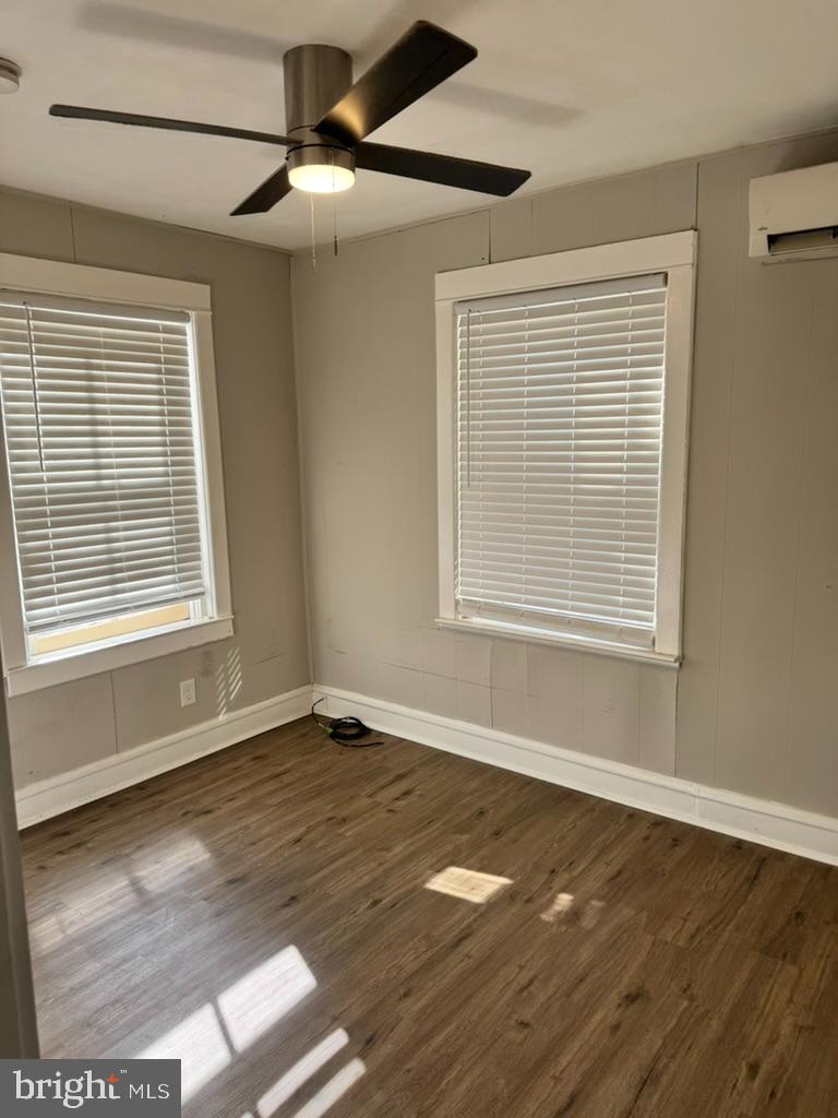 202-206 South Main Street Hatfield, PA 19440 - Photo 6 of 8 a view of an empty room with wooden floor and a window