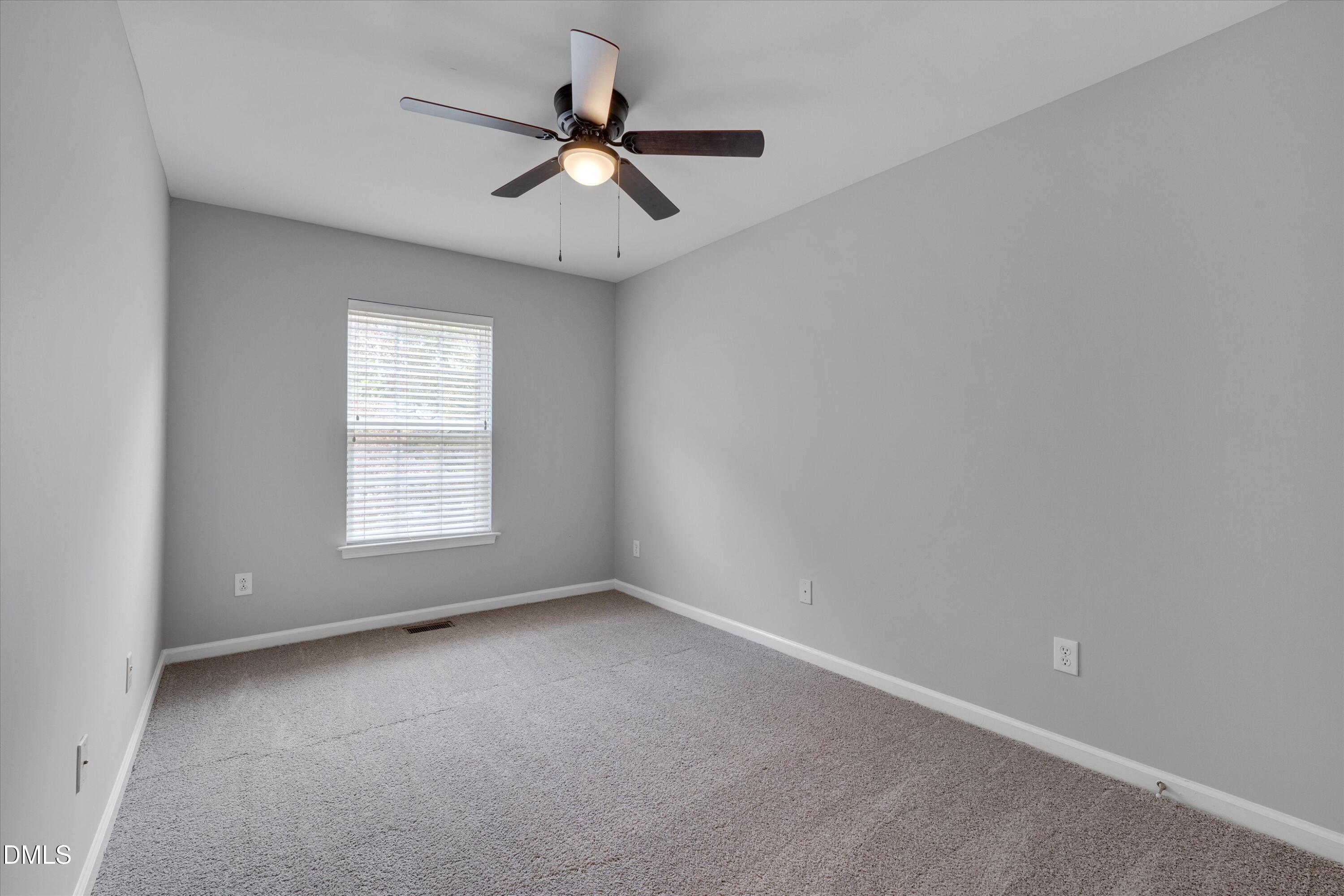 2621 Ivory Run Way, Unit 105 Raleigh, NC 27603 - Photo 14 of 21 an empty room with a window