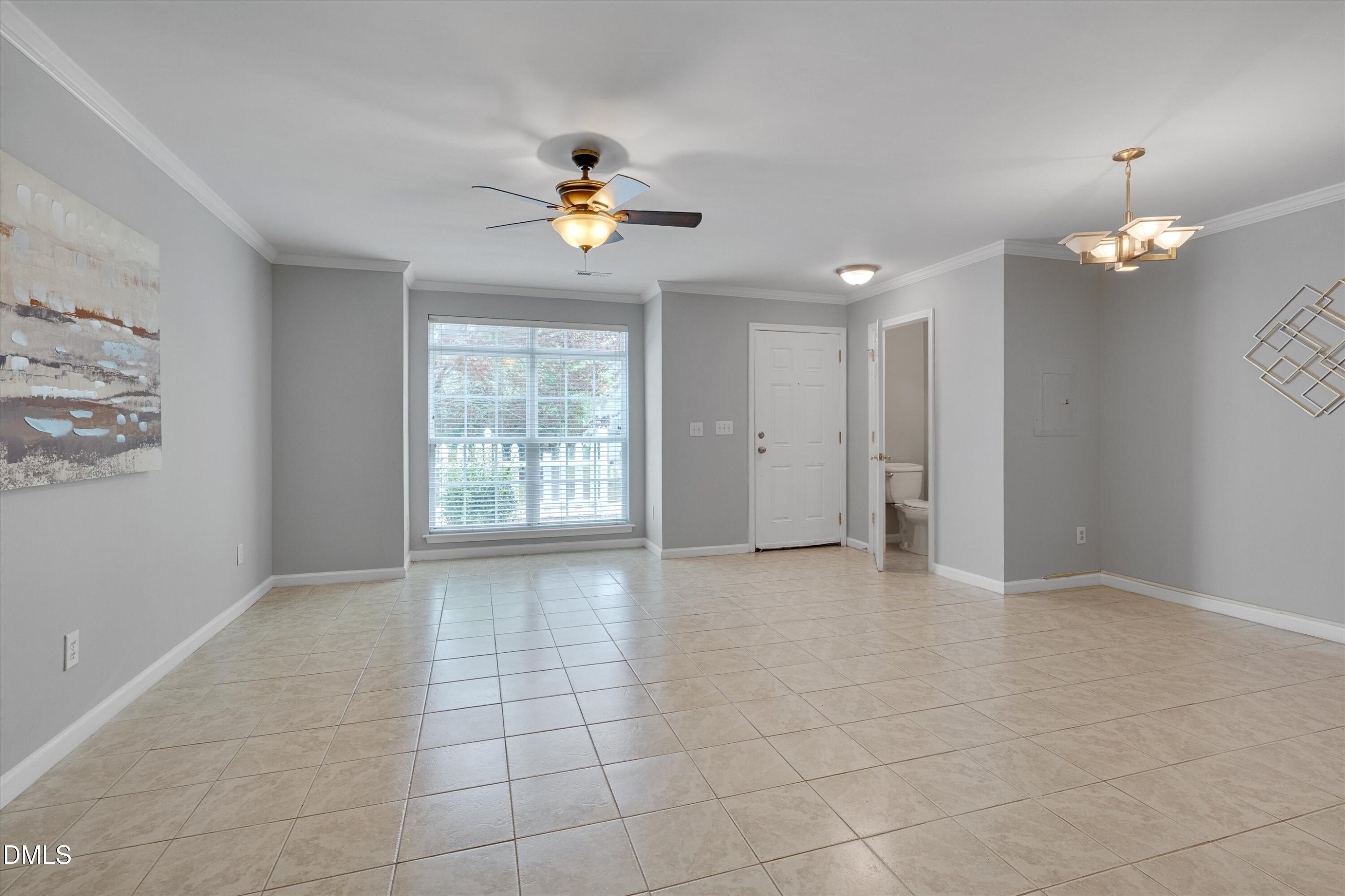 2621 Ivory Run Way, Unit 105 Raleigh, NC 27603 - Photo 4 of 21 a view of an empty room with a window