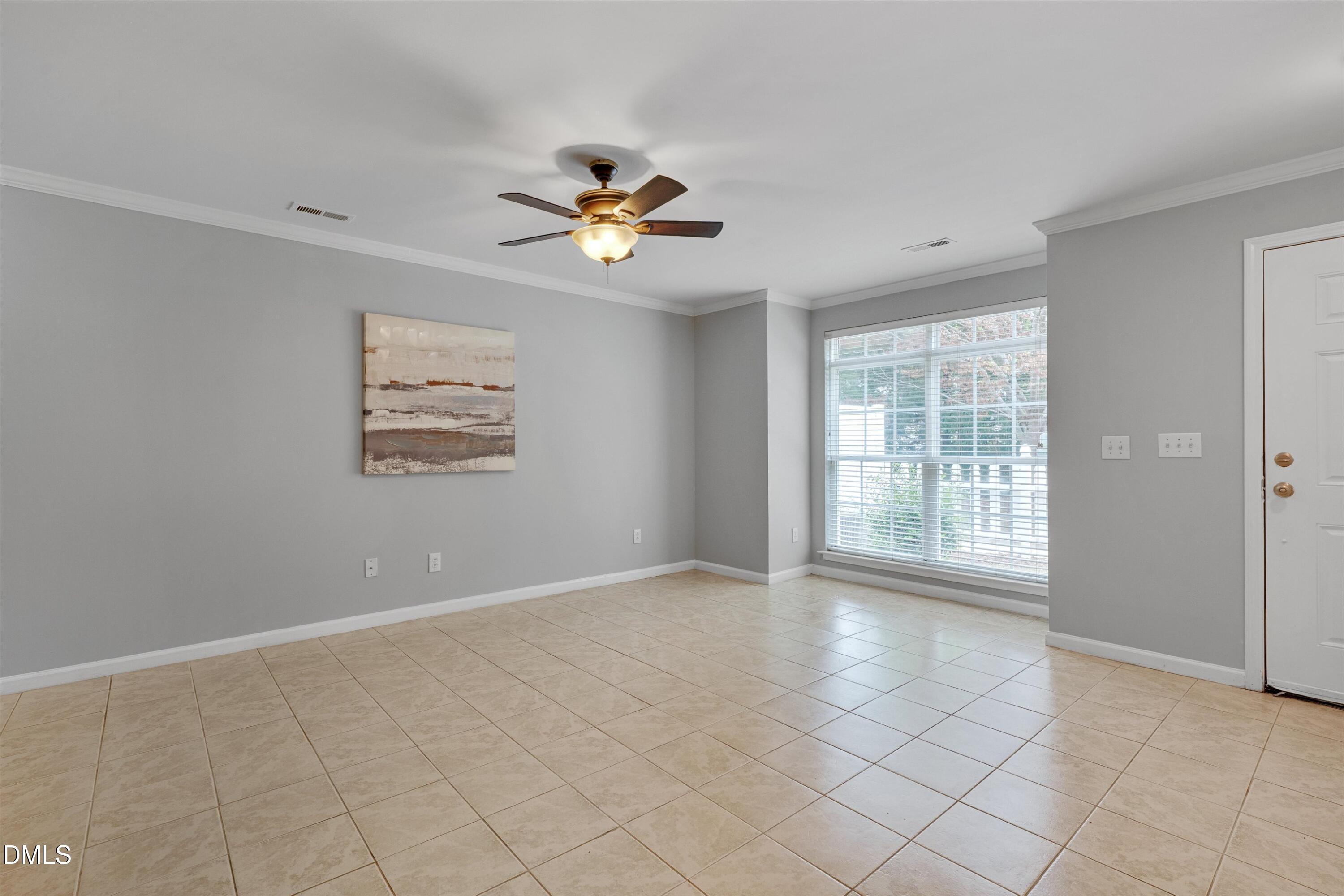 2621 Ivory Run Way, Unit 105 Raleigh, NC 27603 - Photo 6 of 21 a view of an empty room with a window
