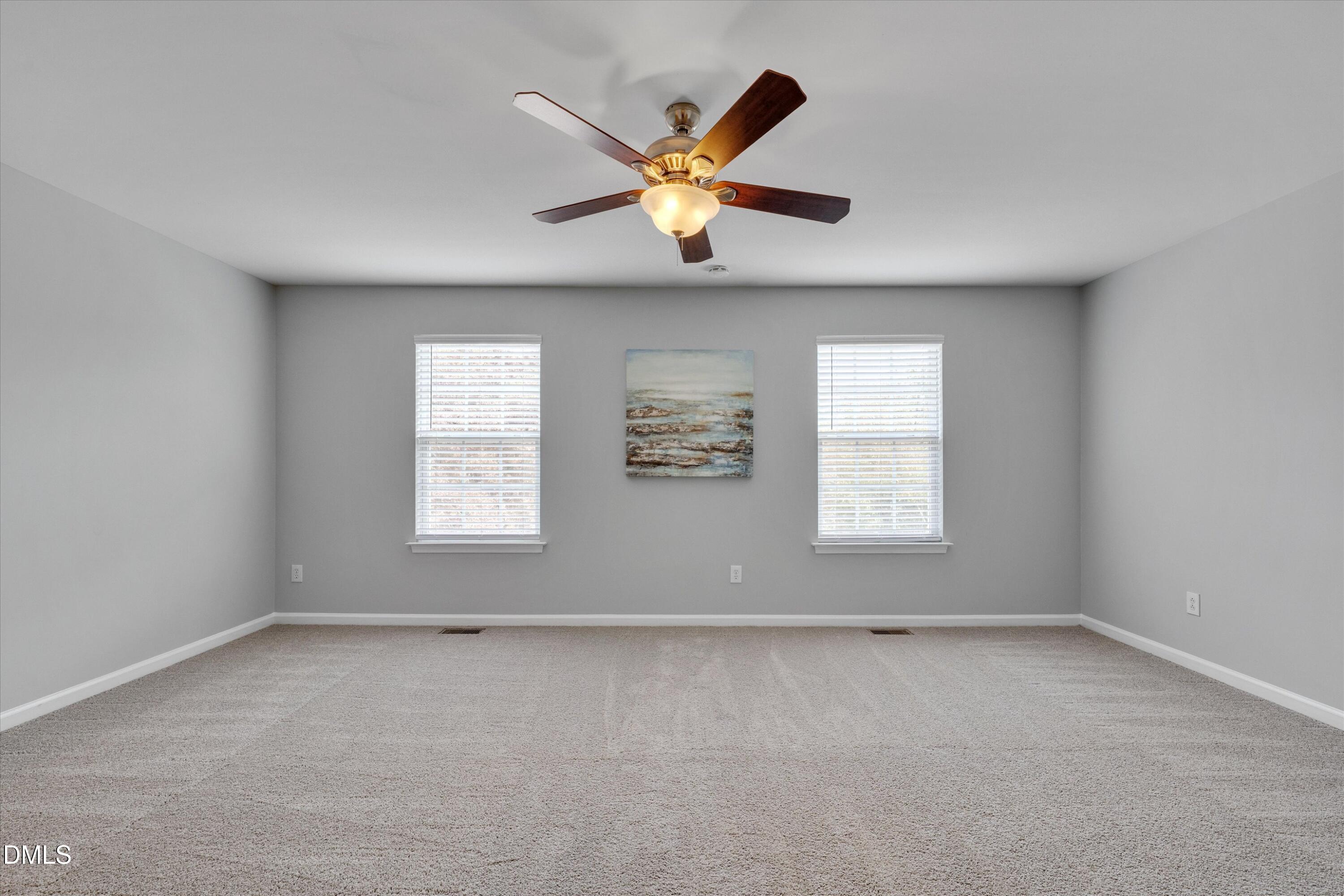 2621 Ivory Run Way, Unit 105 Raleigh, NC 27603 - Photo 8 of 21 an empty room with window and windows