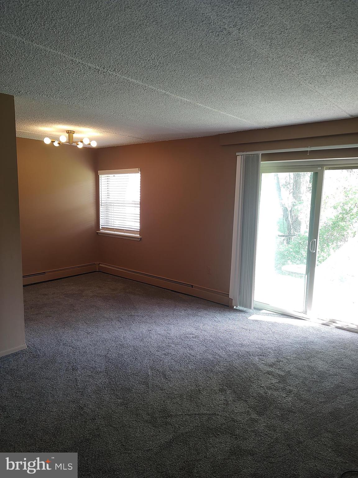 280 Bridgewater Road, Unit D1 Brookhaven, PA 19015 - Photo 3 of 15 an empty room with windows