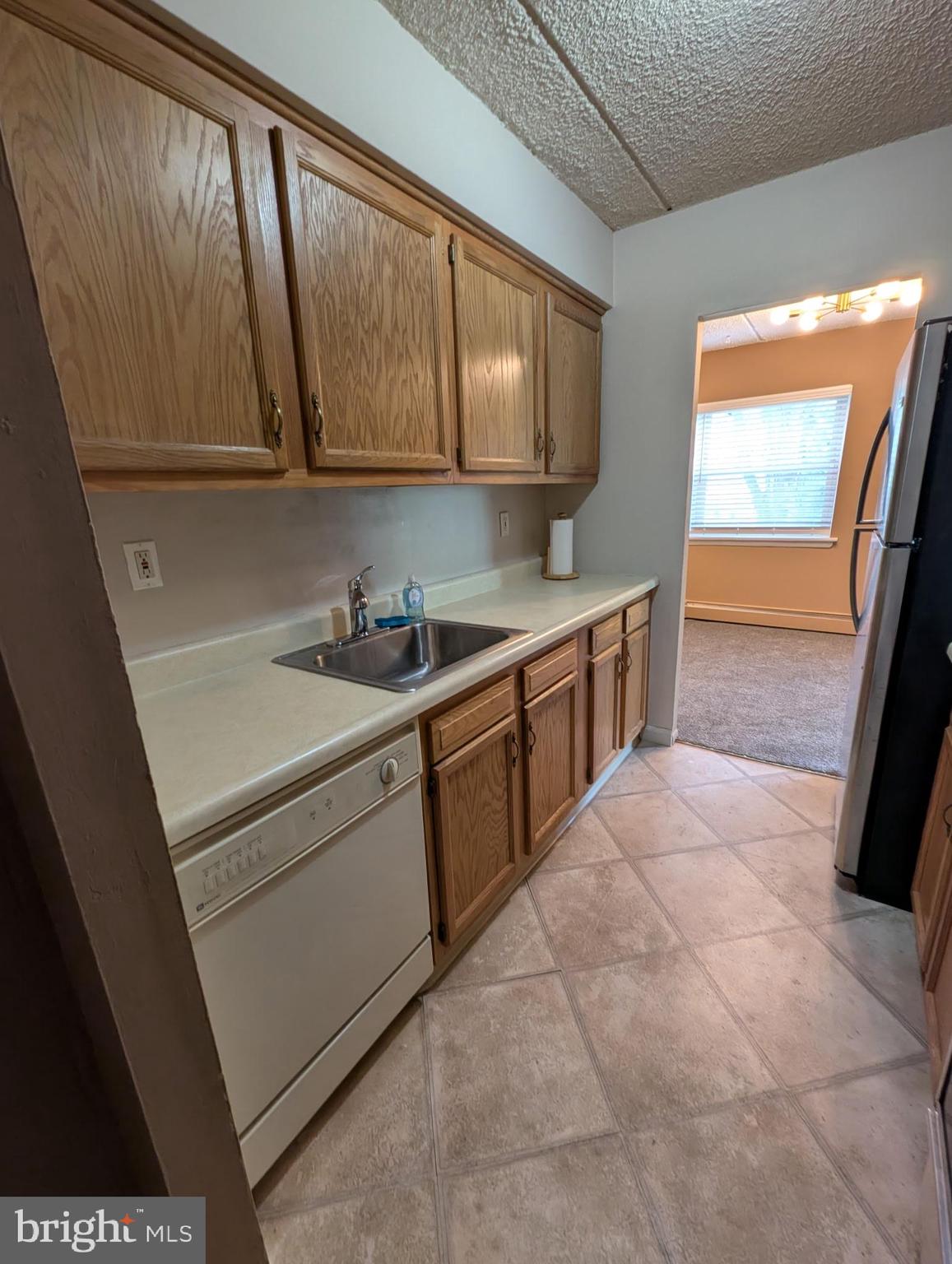280 Bridgewater Road, Unit D1 Brookhaven, PA 19015 - Photo 6 of 15 a kitchen with a sink and cabinets