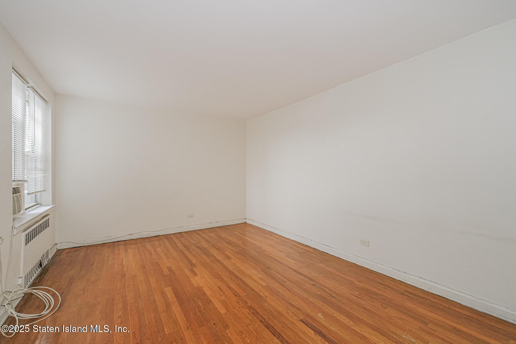 36 Dahill Road, Unit 4F Brooklyn, NY 11218 - Photo 15 of 25 a view of empty room with wooden floor