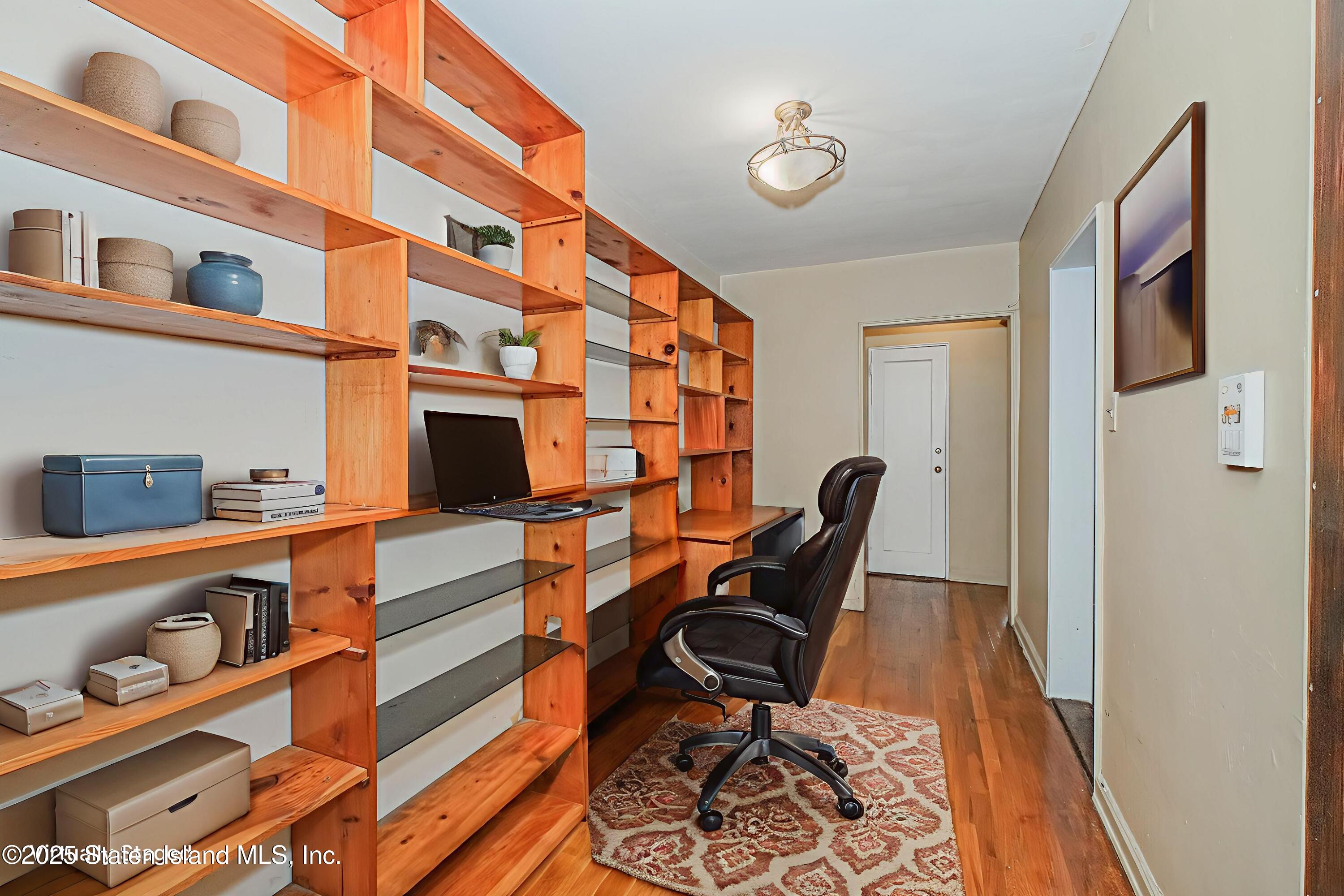 36 Dahill Road, Unit 4F Brooklyn, NY 11218 - Photo 6 of 25 a work space with furniture and wooden floor