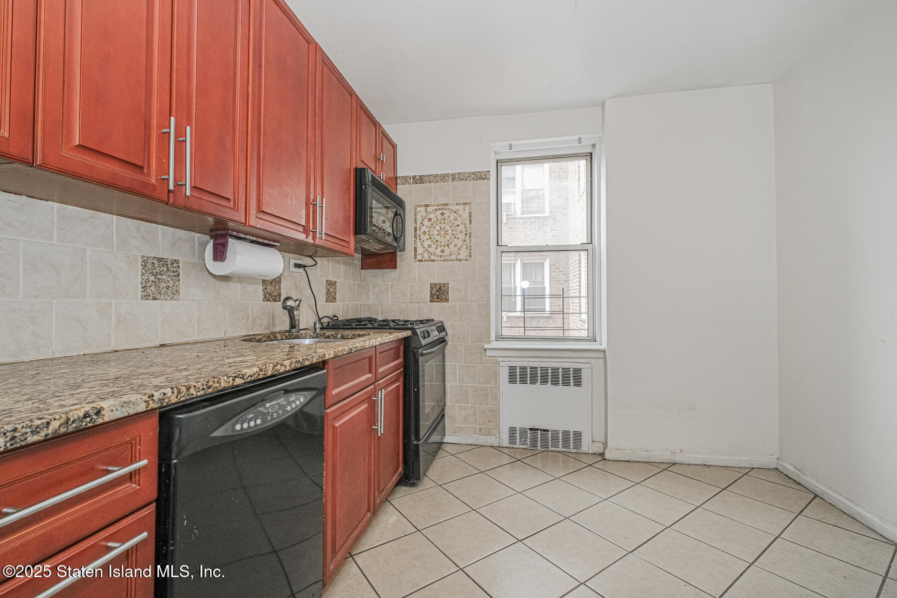 36 Dahill Road, Unit 4F Brooklyn, NY 11218 - Photo 10 of 25 a kitchen with stainless steel appliances granite countertop a sink and a white cabinets