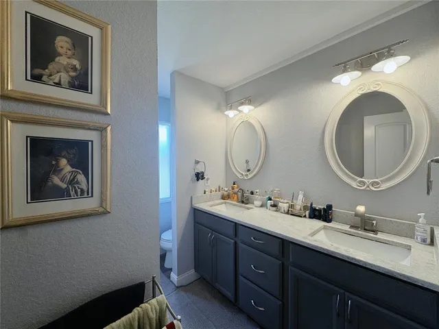 a view of a hallway with wooden floor and closet