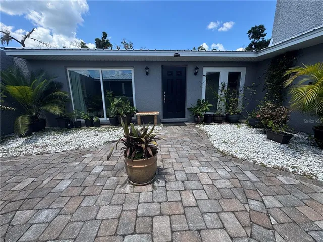a bed room with furniture and a large window