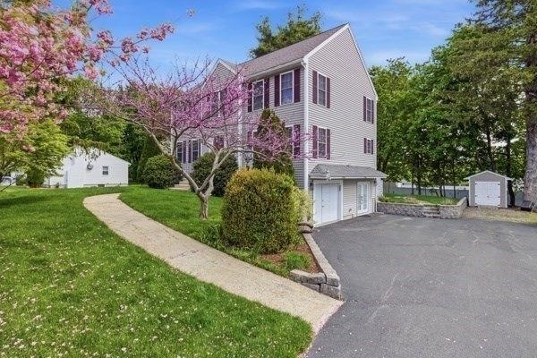 3 Wing Road Wilmington, MA 01887 - Photo 33 of 36 a front view of a house with a yard and trees