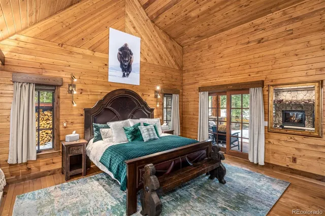 a living room with fireplace furniture and a flat screen tv