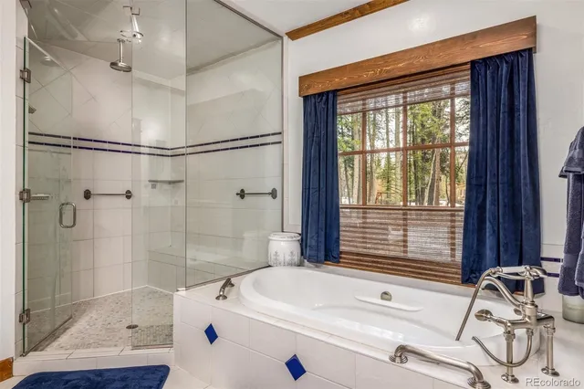 a bed room with a bed and a chair