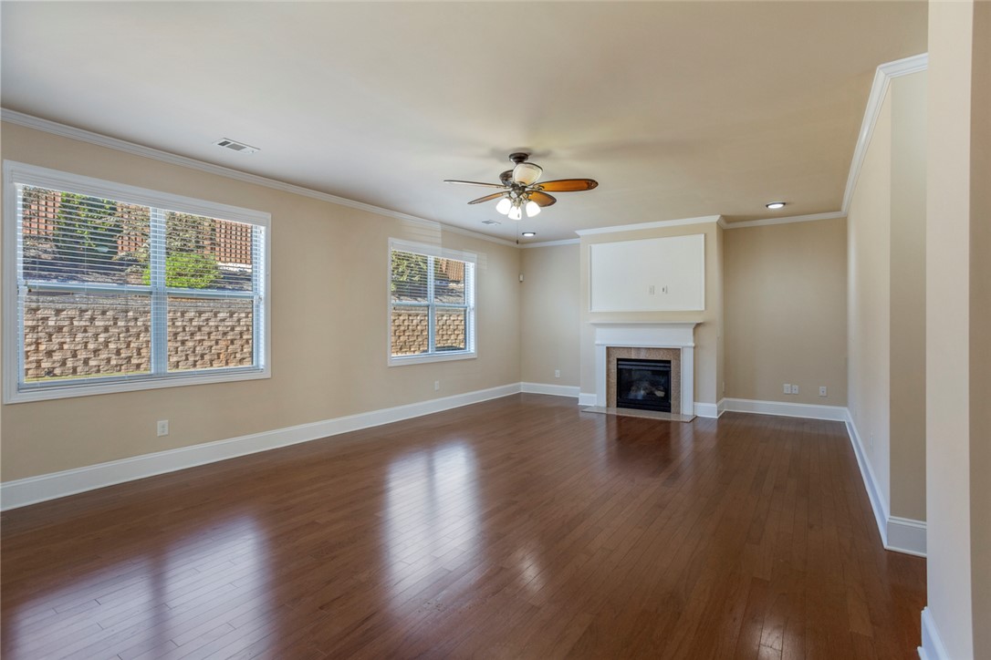 1005 Winmar Drive Anderson, SC 29621 - Photo 19 of 50 This expansive living area offers polished wood floors and a charming fireplace, perfect for gatherings.
