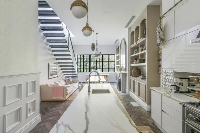 a bedroom with furniture and a large window