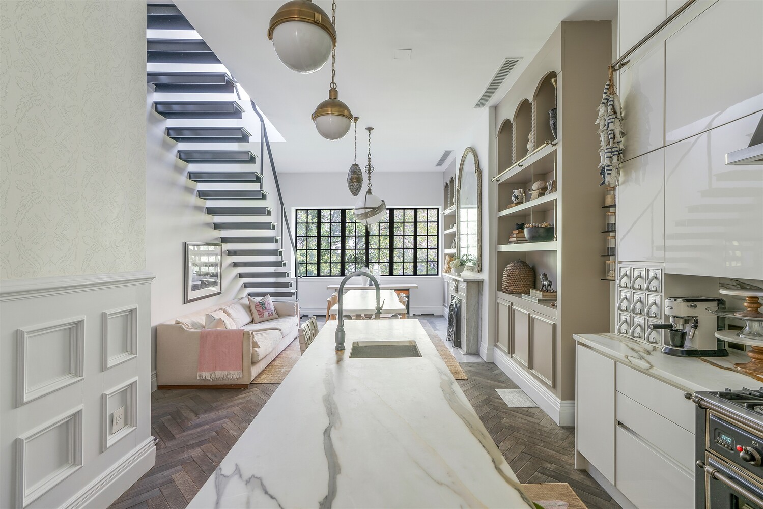 a bedroom with furniture and a large window