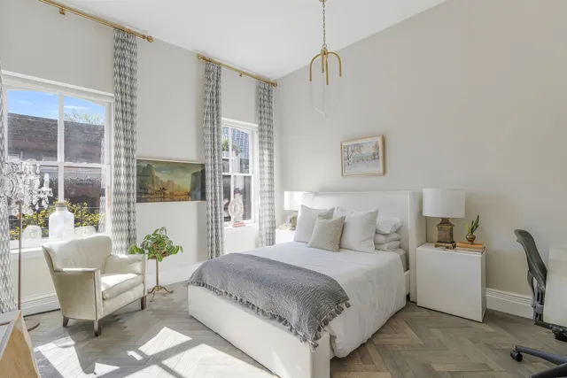 a bathroom with a double vanity sink and mirror