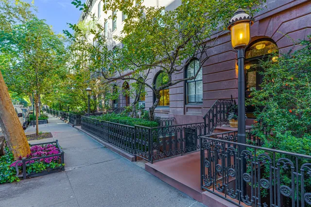 a view of a balcony with chair and wooden floor