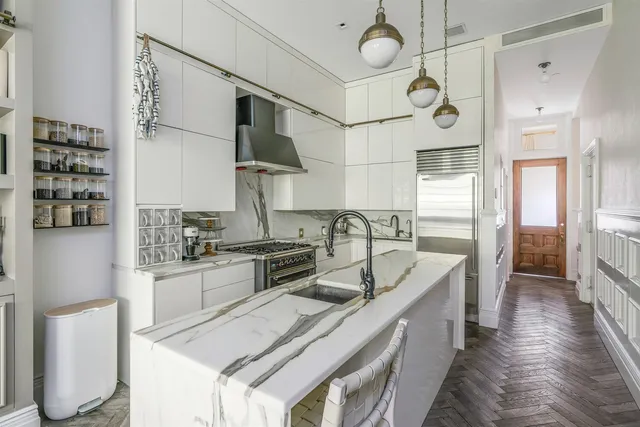 a view of swimming pool with outdoor seating and plants