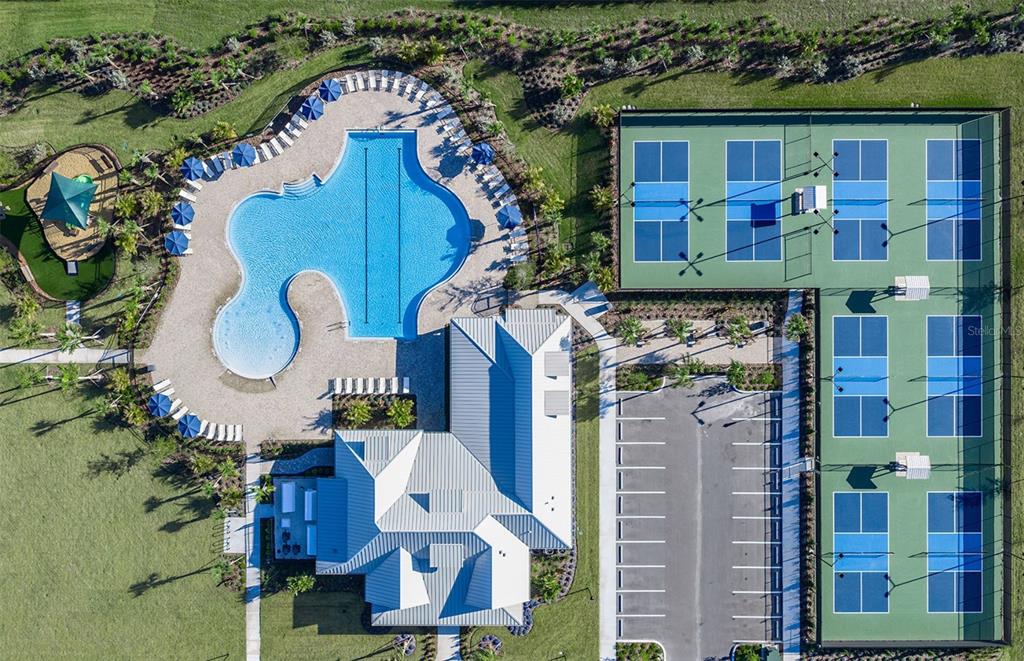 5342 Spring Maiden Circle Apollo Beach, FL 33572 - Photo 21 of 25 a front view of multi story residential apartment building with yard and seating area